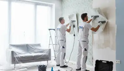 Professional wallpaper removal by house painters in Madison, WI preparing walls for fresh paint